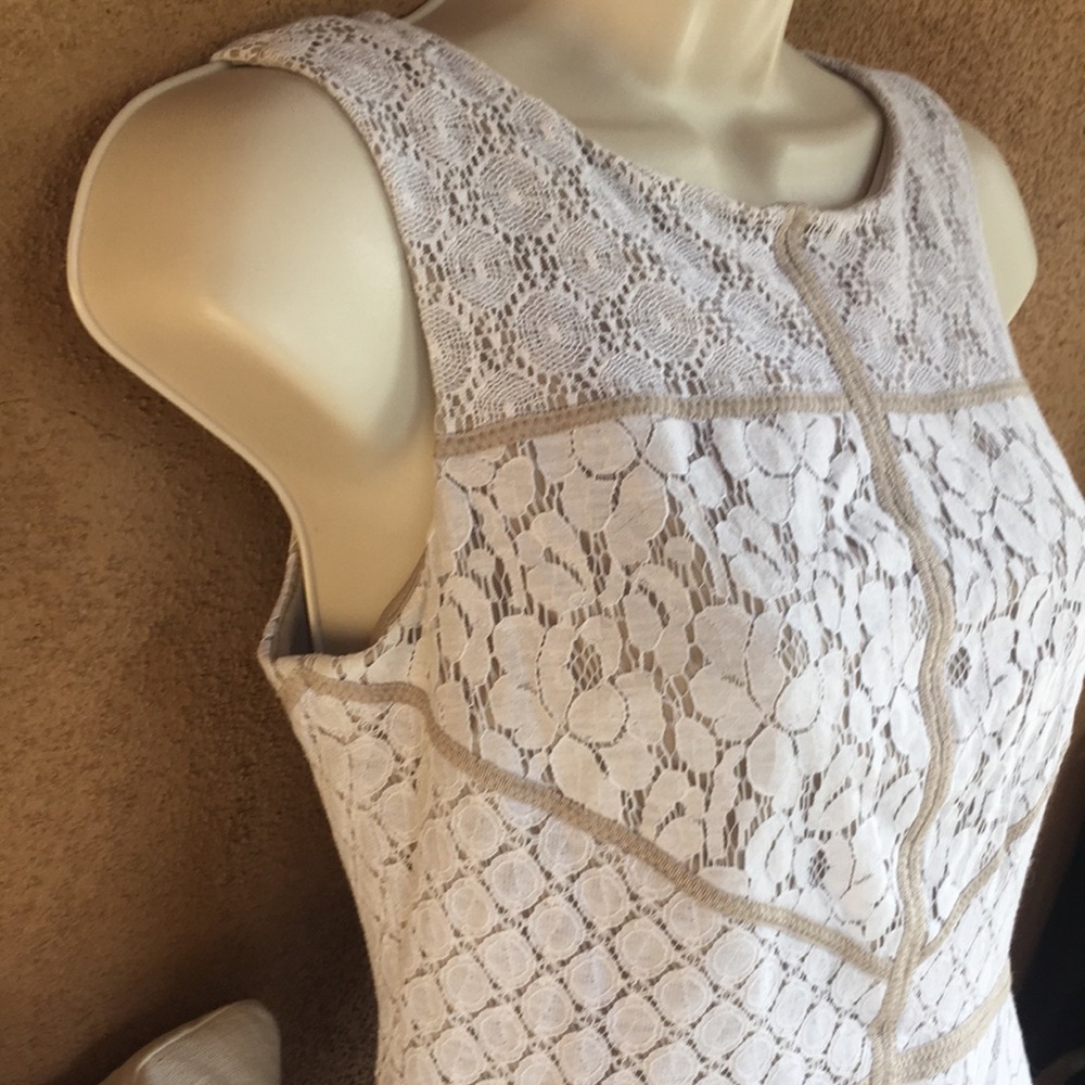 Timeless Maggie London white islet dress. Fully lined in nude Size 6 above knee